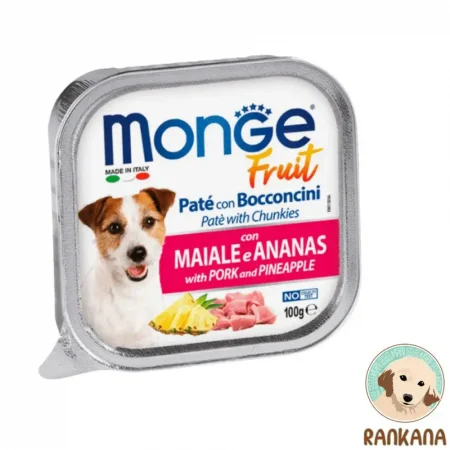 Tina de comida húmeda para perros Monge Fruit con sabor a cerdo y piña, formato de 100 gramos. La etiqueta muestra la imagen de un perro Jack Russell, rodajas de piña fresca y trozos de carne de cerdo, con el texto "MONGE Fruit" y "Paté with PORK and PINEAPPLE".